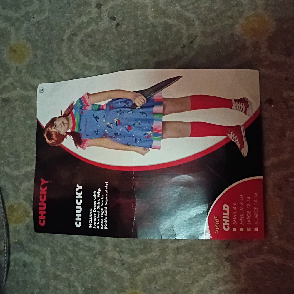 Spirit Chucky Costume with Blue Dress and Red Wig And Red Socks. Warn Once.